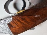 9067
Browning FN Superposed Diana Grade!!
SUPER RARE..
By R Kowalski Master Engraver, signed on BOTH Sides, Made in 1969, 2 3/4 chambers, 30” venti - 20 of 25