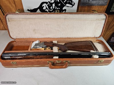 9067
Browning FN Superposed Diana Grade!!
SUPER RARE..
By R Kowalski Master Engraver, signed on BOTH Sides, Made in 1969, 2 3/4 chambers, 30” venti