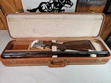 9067
Browning FN Superposed Diana Grade!!
SUPER RARE..
By R Kowalski Master Engraver, signed on BOTH Sides, Made in 1969, 2 3/4 chambers, 30” venti