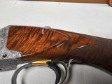 9067
Browning FN Superposed Diana Grade!!
SUPER RARE..
By R Kowalski Master Engraver, signed on BOTH Sides, Made in 1969, 2 3/4 chambers, 30” venti - 6 of 25