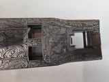9067
Browning FN Superposed Diana Grade!!
SUPER RARE..
By R Kowalski Master Engraver, signed on BOTH Sides, Made in 1969, 2 3/4 chambers, 30” venti - 13 of 25