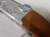 9080
SKB 600, 410 Gauge, 28” Barrels, IC/IC, extensive heavy engraving, gold trigger, pigeon grip with cap, 14 1/4 LOP, factory pad, extractors, cros - 8 of 25