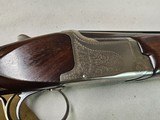 9082
Winchester 101 Super grade XTR, (Pigeon) 12 Gauge, M/F 28” Barrels, Round Knob, 14 1/2 LOP, butt pad, vent rib,
AA++, fancy tiger striped feath - 25 of 25