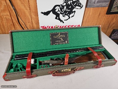 9103
Arrieta SXS Shotgun, 20 Gauge, 28” Barrels, Cycl/IC, Double triggers, ejectors, splinter forearm, straight grip, 7 pin side lock, engraved, but