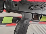 9102
Kalashnikov Shotgun 12 gauge, semi auto, folding stock, arm guard, pistol hand grip, picatinny rails, hard case, papers, 99% condition, 3 10 rou - 17 of 23