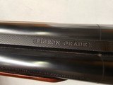 9115
Winchester Model 23 Pigeon Grade,
12 Gauge 2 3/4 and 3”, 28” barrels, M/F, single selective trigger, ejectors, vent rib, round knob, 2 white be - 18 of 25