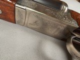 9115
Winchester Model 23 Pigeon Grade,
12 Gauge 2 3/4 and 3”, 28” barrels, M/F, single selective trigger, ejectors, vent rib, round knob, 2 white be - 8 of 25