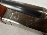 9115
Winchester Model 23 Pigeon Grade,
12 Gauge 2 3/4 and 3”, 28” barrels, M/F, single selective trigger, ejectors, vent rib, round knob, 2 white be - 9 of 25