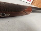 9115
Winchester Model 23 Pigeon Grade,
12 Gauge 2 3/4 and 3”, 28” barrels, M/F, single selective trigger, ejectors, vent rib, round knob, 2 white be - 24 of 25