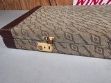 9185
Winchester Diamond Grade shotgun case. This is a rare case that will hold two barrels. Has been used. This case will hold up to 34” barrels. Mor - 6 of 25