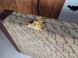 9185
Winchester Diamond Grade shotgun case. This is a rare case that will hold two barrels. Has been used. This case will hold up to 34” barrels. Mor - 14 of 25