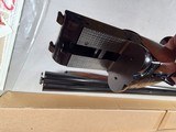 9191
Winchester 23 Classic 20 Gauge, 26” barrels, IC/Mod, 14 1/4 LOP. Beautiful side x side, possibly unfired shotgun, all paperwork, all inserts and - 20 of 24