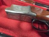 9207
Winchester 101 lightweight 12 gauge, screw in winchokes x 5 ( M, IM, XF, IC, SK) 27” barrels, 14 1/4 LOP, Butt pad, vent rib, ejectors, pistol g - 7 of 25