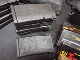 9220
308 Win ammo, magazines, mag sling pouch and ammo box, this collection comes with 7- 25 round magpull magazines with 308 ammo loaded in each one - 2 of 23