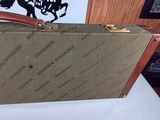 9222
Winchester green shotgun trunk style case with red interior, New old stock, will hot up to a 26” barrel.
With original keys and key fob.More pi - 16 of 18