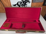 9222
Winchester green shotgun trunk style case with red interior, New old stock, will hot up to a 26” barrel.
With original keys and key fob.More pi