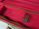 9222
Winchester green shotgun trunk style case with red interior, New old stock, will hot up to a 26” barrel.
With original keys and key fob.More pi - 4 of 18
