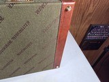 9222
Winchester green shotgun trunk style case with red interior, New old stock, will hot up to a 26” barrel.
With original keys and key fob.More pi - 15 of 18