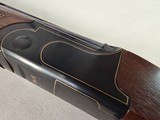 9246
Fair, Jubilee 700, 12 Gauge, Mde in Italy, Full/Full, 30” Barrels, 14 1/2 LOP, Adjustable pad, vent rib, Blue with gold trim, gold single trigge - 11 of 25
