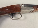 9257
Winchester Model 23 XTR Pigeon grade Side by side shotgun, 20 Gauge, IC/MOD choked, Round Knob, Butt pad, Single Selective trigger, vent rib, 26 - 20 of 24
