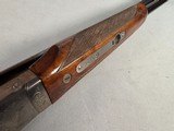9257
Winchester Model 23 XTR Pigeon grade Side by side shotgun, 20 Gauge, IC/MOD choked, Round Knob, Butt pad, Single Selective trigger, vent rib, 26 - 17 of 24