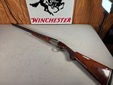 9257
Winchester Model 23 XTR Pigeon grade Side by side shotgun, 20 Gauge, IC/MOD choked, Round Knob, Butt pad, Single Selective trigger, vent rib, 26 - 1 of 24