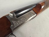 9257
Winchester Model 23 XTR Pigeon grade Side by side shotgun, 20 Gauge, IC/MOD choked, Round Knob, Butt pad, Single Selective trigger, vent rib, 26 - 19 of 24