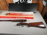 9262 Winchester 101 Ruffed Grouse Society, 20 Gauge, 26” barrels, IC/MOD, round knob, vent rib, butt pad, 14 1/4 LOP, fancy tiger stripped fancy waln
