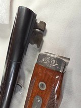 9259
Winchester Model 23 Pigeon XTR, 20 Gauge, 26” barrels, IC/MOD, Round Knob, Ejectors, vent rib, butt pad, coin silver receiver, beaver tail, 14 1 - 19 of 25