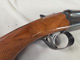 9268
Ithaca 100 20 gauge, 28” barrels, M/F, single selective trigger, pistol grip with cap, butt plate, scalloped receiver, red optic front site, 14 - 22 of 25