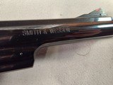 9276
Smith and Wesson 57-6, 41 Magnum, 6” barrel, Hi-Viz red camp front sight, N Target Frame, 6 shot, Micrometer rear, special oversized grips, shro - 12 of 19