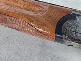 9289
Weatherby Regency 12 Gauge, over and under,
2 3/4 chambers, side lock, IM/F fixed chokes, Greener cross bolt, gold trigger, 28” barrels, pistol - 11 of 25