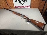 9365Ithaca trap model, 12 gauge, 2 3/4 chamber, vent rib, gold trigger, engraved, pistol grip, butt pad, 34” barrel, 14 1/4 LOP, ful choke single sh