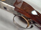 9375SKB 606 Ducks Unlimited Banquet, 12 Gauge, 28 Barrels, screw in chokes (2 SK, IC, M, F) wrench, and choke box, gold retriever with duck, pistol - Image 24 of 25