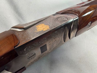 9375SKB 606 Ducks Unlimited Banquet, 12 Gauge, 28 Barrels, screw in chokes (2 SK, IC, M, F) wrench, and choke box, gold retriever with duck, pistol - Image 21 of 25