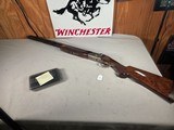 9375SKB 606 Ducks Unlimited Banquet, 12 Gauge, 28 Barrels, screw in chokes (2 SK, IC, M, F) wrench, and choke box, gold retriever with duck, pistol