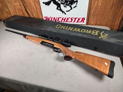 9398Browning X Bolt, 270 Cal, 22” barrel, Rosewood cap, muzzle brake, Leupold 3.5x10x40 , Tiger striped wood, with box, More pictures AT DawsonsDoub - Image 1 of 25