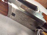 9403SKB 385 12 Gauge, 28” barrels, single non selective trigger, ejectors, pistol grip, butt pad, silver receiver, with engraving, auto safety remov - Image 8 of 23