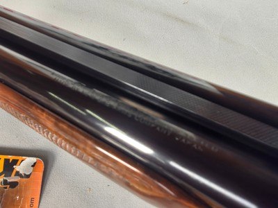 9403SKB 385 12 Gauge, 28” barrels, single non selective trigger, ejectors, pistol grip, butt pad, silver receiver, with engraving, auto safety remov - Image 10 of 23