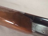 9403SKB 385 12 Gauge, 28” barrels, single non selective trigger, ejectors, pistol grip, butt pad, silver receiver, with engraving, auto safety remov
