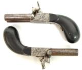 "Pair of French side by side pocket pistols. (AH2733)"