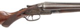 Meriden Firearms Co. The Aubrey Model 12 gauge Damascus barrel shotgun. Barrels are 32