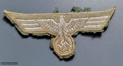 German WW II silver wire brocade breast eagle used by officers and EM mothed.