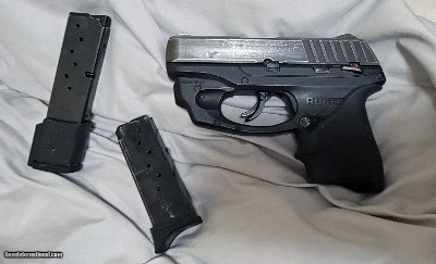 Ruger EC9s subcompact 9mm striker fired pistol with red LaserMax and spare 9 cap mag.