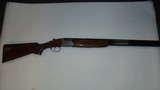 Over Under Silver 12 Gauge Shotgun - 1 of 6