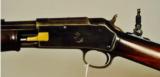 Colt Lightning, .22 cal. slide action rifle.
- 6 of 8