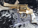 1955 Smith & Wesson Pre-18 , .22 Combat Masterpiece, Factory Engraved, Gold W/Mother of Pearl - 1 of 25