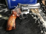 1982 Smith & Wesson model 586 no-dash,“Distinguished .357 Combat Magnum Revolver “ Nickel, Boxed, 4 inch.