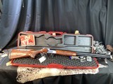 Winchester Select Energy Trap O/U Shotgun, 12 Ga, 30 inch Ported,
Invector Plus Chokes, Cased, Trades Welcome.