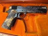 Colt Series 70 1911Government Model,
Engraved W/Gold Inlay, Carved Ivory Grips, in Colt Custom Shop Presentation Case - 1 of 25